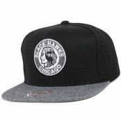 Mitchell&Ness - NHL Svart snapback Keps - Chicago Blackhawks Black Melange Fill Snapback@ Hatstore